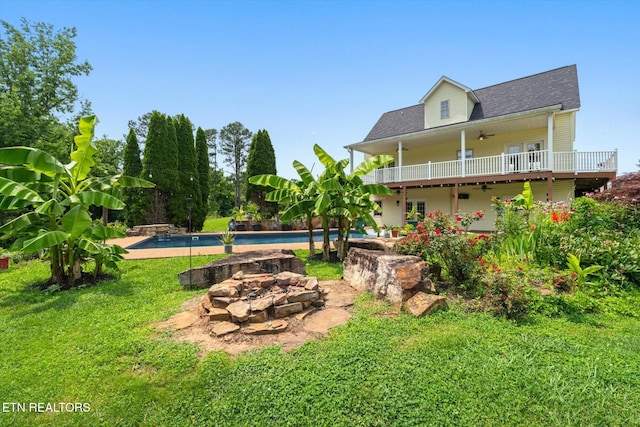 171 Wrenwood Way, Greenback, TN 37742 - view of grassy yard featuring a ceiling fan, an outdoor fire pit, an outdoor pool, and a patio
