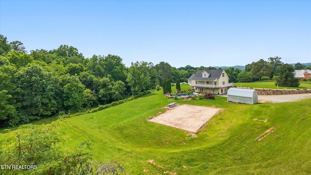 171 Wrenwood Way, Greenback, TN 37742 - view of grassy yard with a storage unit