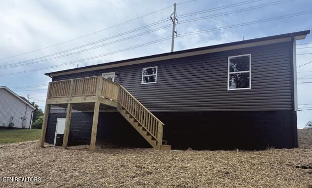408 Luttrell Rd, Maynardville, TN 37807 - back of property with stairway and a deck
