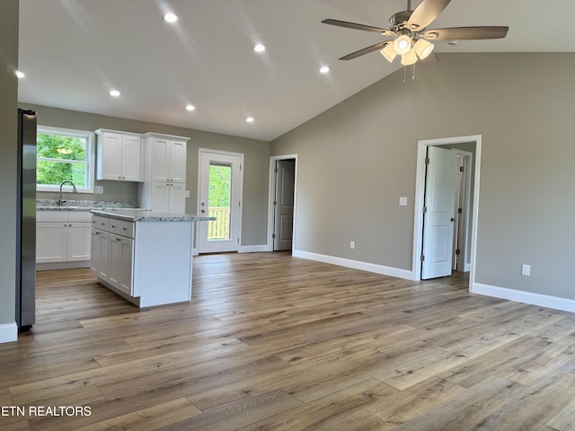408 Luttrell Rd, Maynardville, TN 37807 - kitchen with healthy amount of natural light, white cabinets, open floor plan, light wood-style floors, and recessed lighting