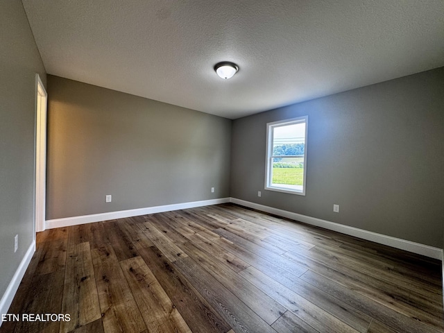 408 Luttrell Rd, Maynardville, TN 37807 - spare room with dark wood-type flooring and a textured ceiling