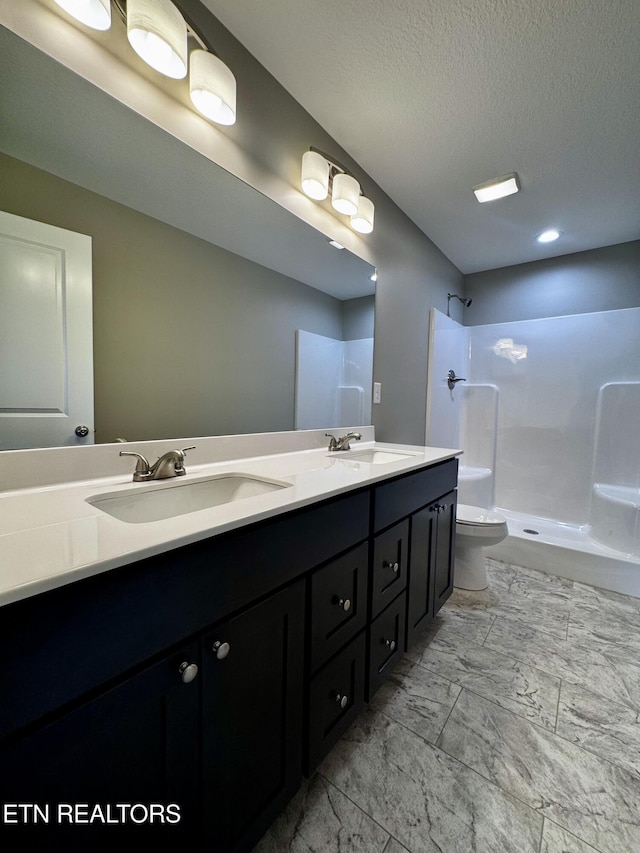 408 Luttrell Rd, Maynardville, TN 37807 - full bath with a shower, double vanity, marble look tiles, and a textured ceiling