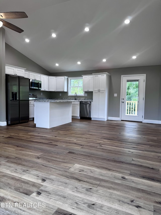 408 Luttrell Rd, Maynardville, TN 37807 - kitchen with appliances with stainless steel finishes, white cabinets, ceiling fan, vaulted ceiling, and dark wood-type flooring