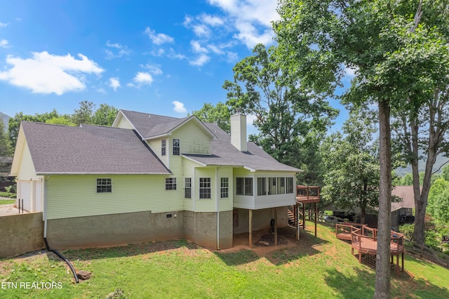 4040 Roundtop Dr, Sevierville, TN 37862 - back of property featuring a chimney, a wooden deck, and a lawn