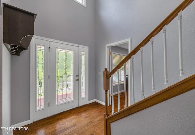 4040 Roundtop Dr, Sevierville, TN 37862 - foyer entrance with stairs, wood-type flooring, and a towering ceiling