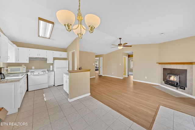 8040 Walt Way, Corryton, TN 37721 - kitchen with white appliances, light tile patterned floors, light countertops, open floor plan, and lofted ceiling