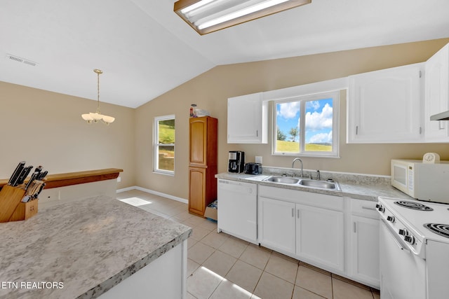 8040 Walt Way, Corryton, TN 37721 - kitchen featuring white appliances, vaulted ceiling, light countertops, white cabinetry, and hanging light fixtures
