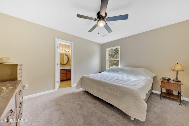 8040 Walt Way, Corryton, TN 37721 - bedroom with light colored carpet, ensuite bathroom, and ceiling fan