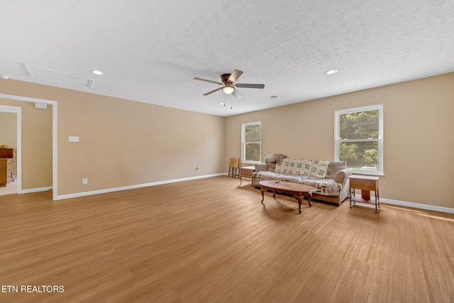 8040 Walt Way, Corryton, TN 37721 - living area featuring a ceiling fan, light wood-style flooring, a textured ceiling, and recessed lighting