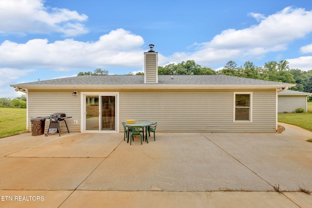 8040 Walt Way, Corryton, TN 37721 - back of house featuring a patio area and a chimney
