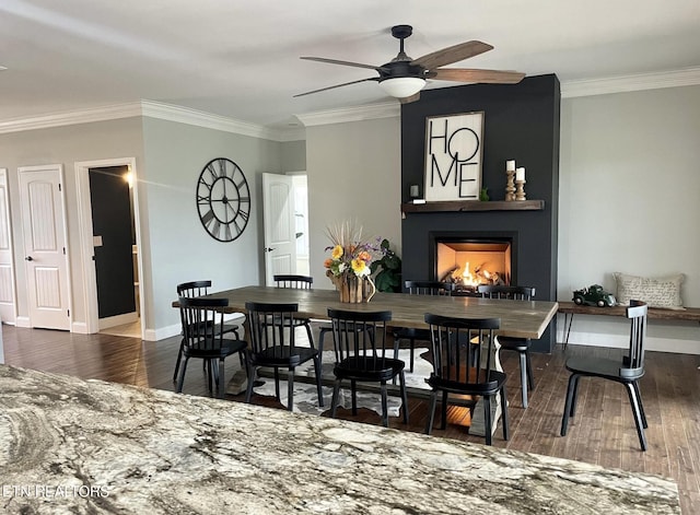 257 Holt Ridge Rd, Tazewell, TN 37879 - dining room with ceiling fan, ornamental molding, a fireplace, and wood finished floors