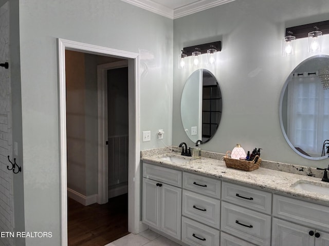 257 Holt Ridge Rd, Tazewell, TN 37879 - bathroom featuring crown molding, double vanity, and wood finished floors