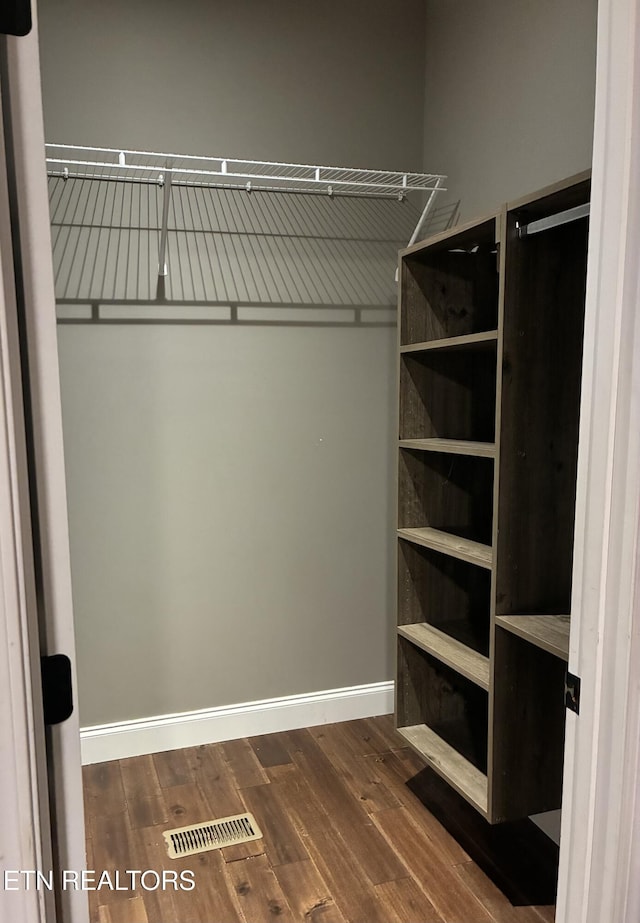 257 Holt Ridge Rd, Tazewell, TN 37879 - spacious closet with dark wood finished floors