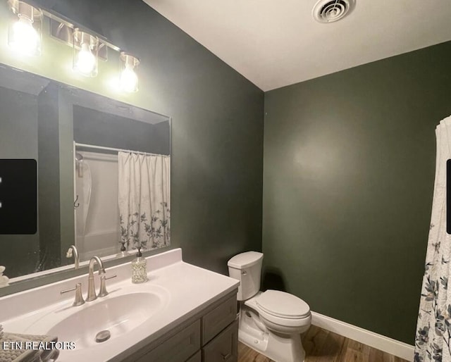 257 Holt Ridge Rd, Tazewell, TN 37879 - full bath with vanity, wood finished floors, and a shower with curtain