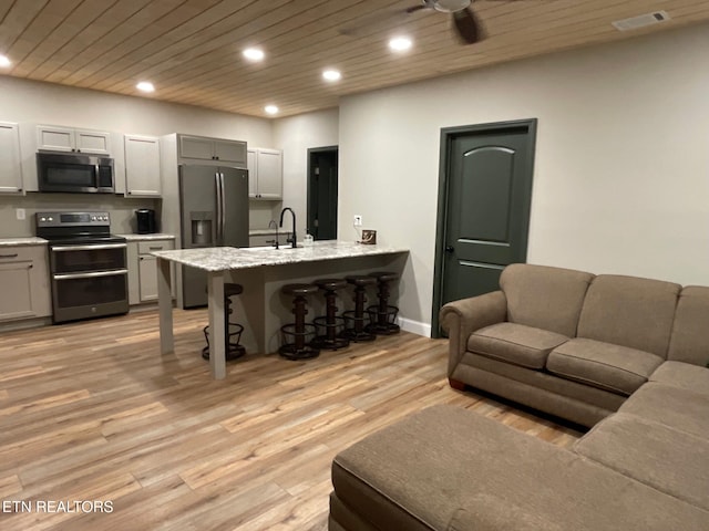257 Holt Ridge Rd, Tazewell, TN 37879 - living area with recessed lighting, light wood-style flooring, wood ceiling, and a ceiling fan