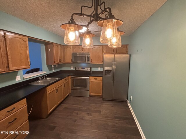 8022 Intervale Way, Powell, TN 37849 - kitchen featuring appliances with stainless steel finishes, a textured ceiling, dark wood-style flooring, and dark countertops