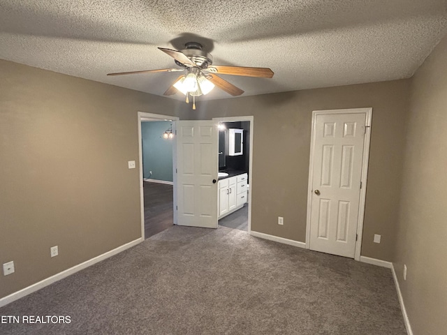 8022 Intervale Way, Powell, TN 37849 - unfurnished bedroom featuring dark carpet, ensuite bathroom, a textured ceiling, and ceiling fan
