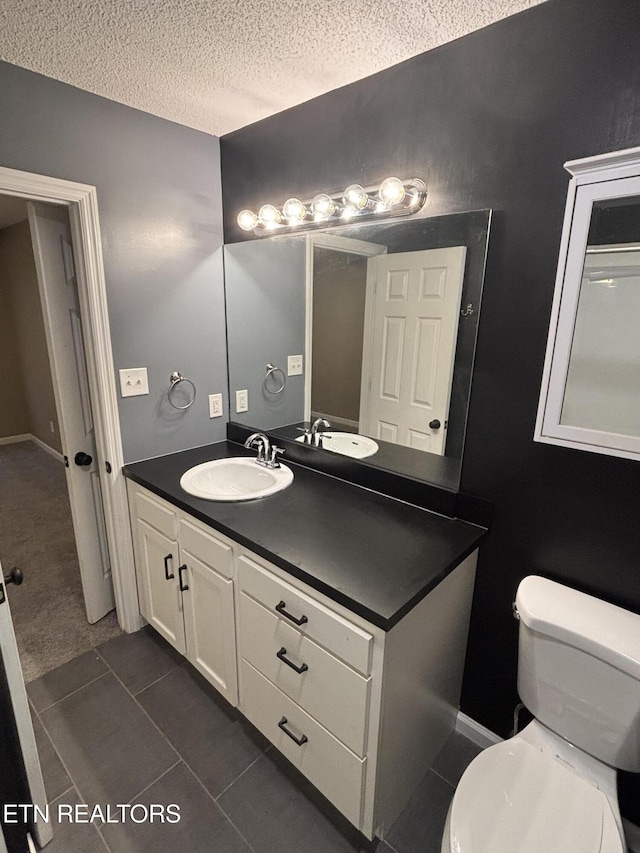 8022 Intervale Way, Powell, TN 37849 - bathroom with vanity, a textured ceiling, and tile patterned flooring