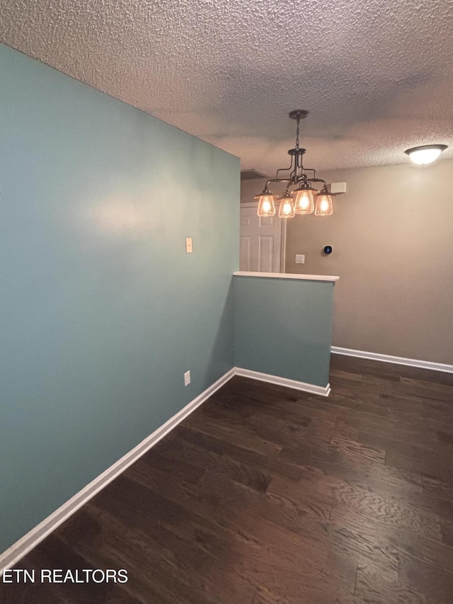 8022 Intervale Way, Powell, TN 37849 - unfurnished room featuring wood finished floors, a textured ceiling, and a chandelier