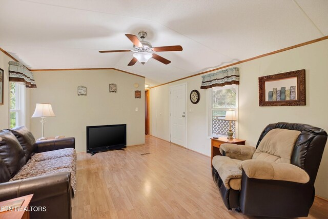 4334 Big Creek Rd, Hartford, TN 37753 - living room with vaulted ceiling, plenty of natural light, ceiling fan, light wood-style floors, and ornamental molding