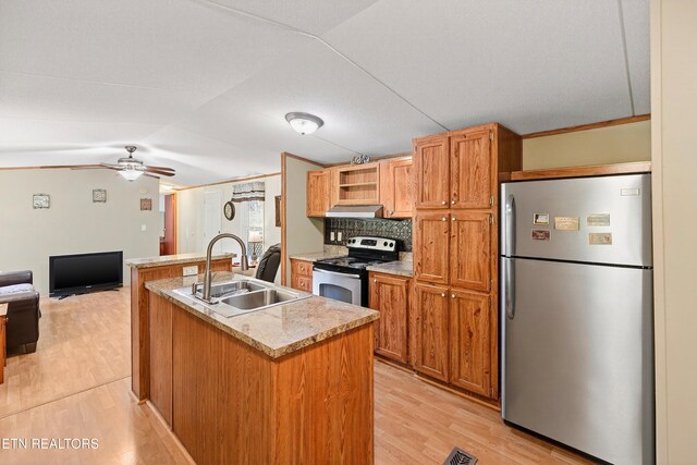 4334 Big Creek Rd, Hartford, TN 37753 - kitchen with appliances with stainless steel finishes, light wood-type flooring, under cabinet range hood, an island with sink, and ceiling fan