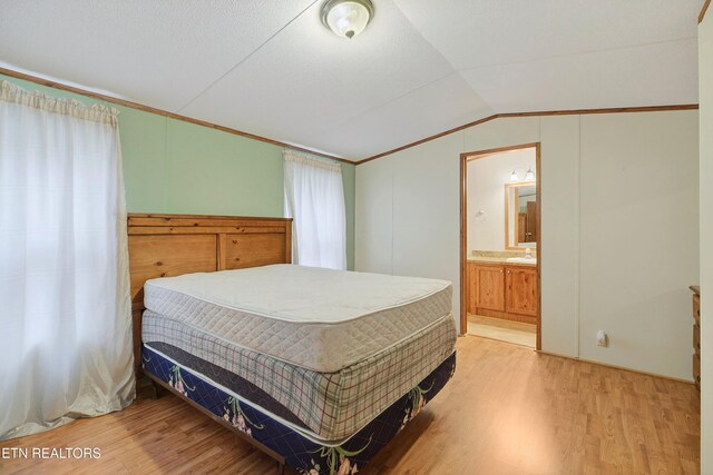4334 Big Creek Rd, Hartford, TN 37753 - bedroom with wood finished floors, lofted ceiling, crown molding, and ensuite bath