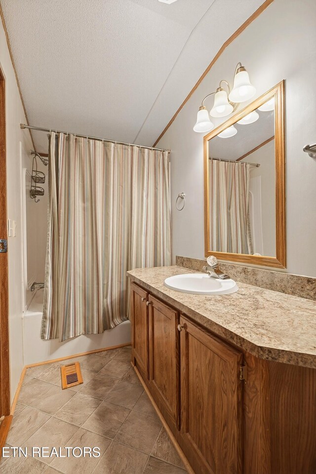 4334 Big Creek Rd, Hartford, TN 37753 - bathroom with vanity, shower / tub combo with curtain, and a textured ceiling