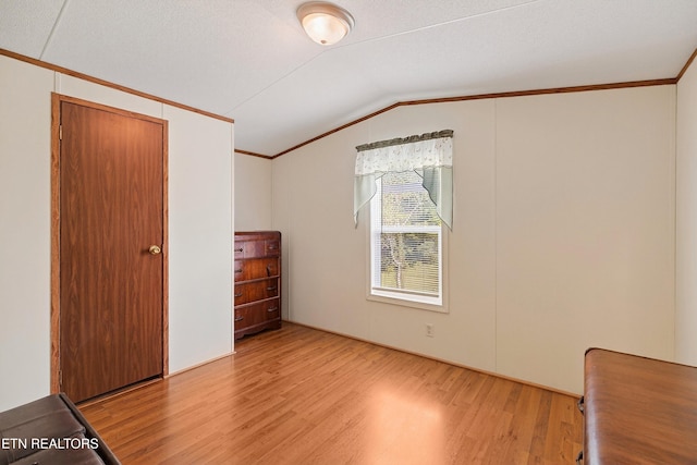 4334 Big Creek Rd, Hartford, TN 37753 - unfurnished bedroom with light wood-type flooring, vaulted ceiling, and crown molding