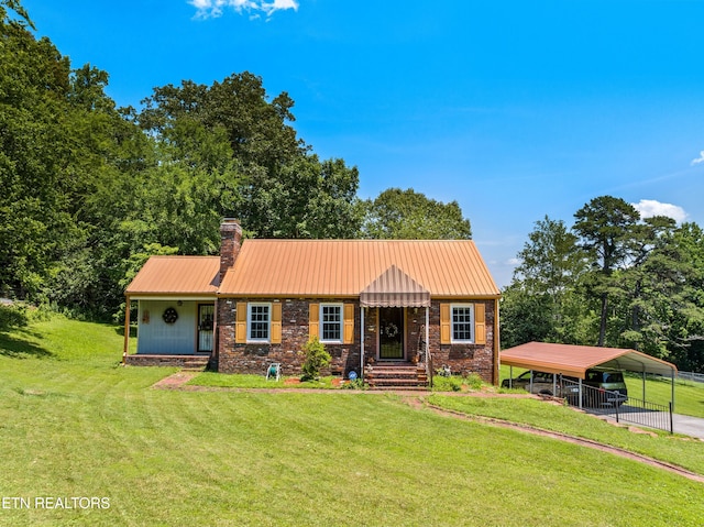 5400 Parkdale Rd, Knoxville, TN 37912 - view of front of home with a carport, a front yard, a chimney, and a metal roof