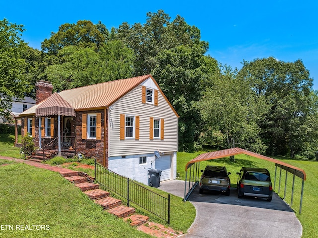 5400 Parkdale Rd, Knoxville, TN 37912 - view of front facade with a carport, driveway, a front lawn, and a metal roof