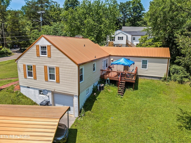 5400 Parkdale Rd, Knoxville, TN 37912 - back of house with a wooden deck, a garage, and a yard