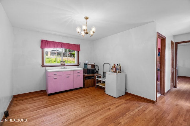 5400 Parkdale Rd, Knoxville, TN 37912 - dining area with light wood finished floors and a chandelier