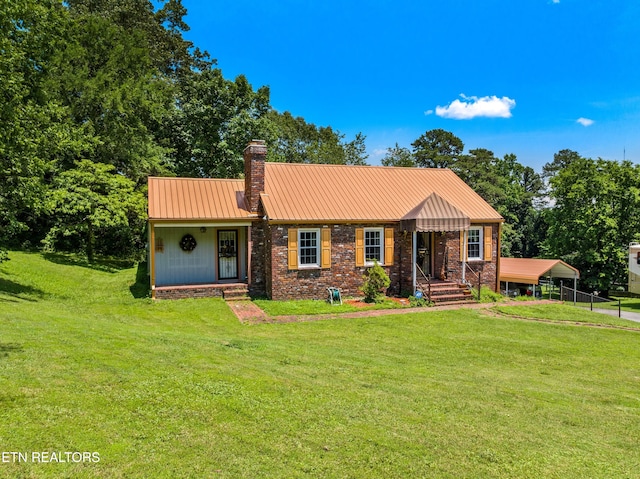 5400 Parkdale Rd, Knoxville, TN 37912 - view of front facade featuring a front yard, a carport, a chimney, and brick siding