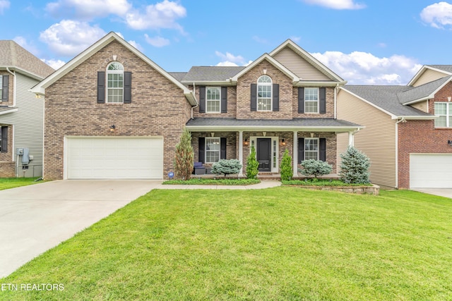6126 Hollow View Ln, Knoxville, TN 37924 - view of front of home featuring a garage, brick siding, concrete driveway, and a front lawn