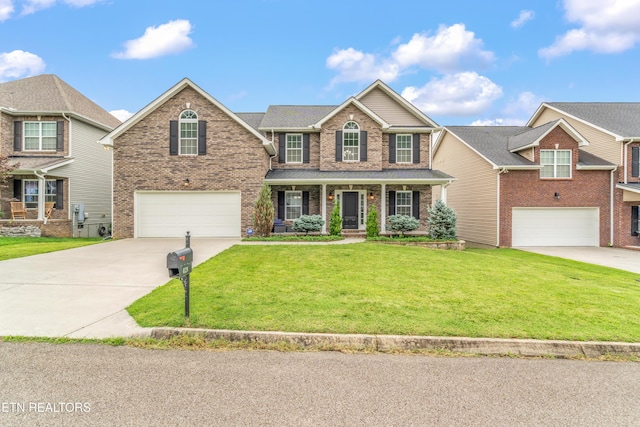 6126 Hollow View Ln, Knoxville, TN 37924 - traditional home with a garage, driveway, brick siding, and a front yard
