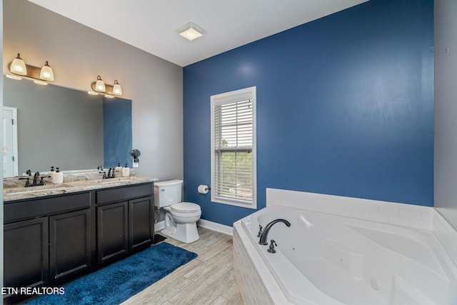 6126 Hollow View Ln, Knoxville, TN 37924 - bathroom with double vanity, a tub with jets, and wood finished floors