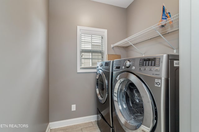 6126 Hollow View Ln, Knoxville, TN 37924 - laundry area with washing machine and dryer and wood finished floors