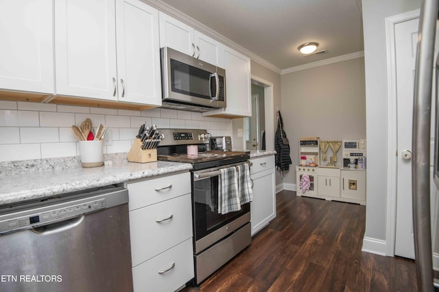 1359 Byrd Cir, Kingston, TN 37763 - kitchen featuring stainless steel appliances, ornamental molding, tasteful backsplash, white cabinetry, and dark wood-style floors