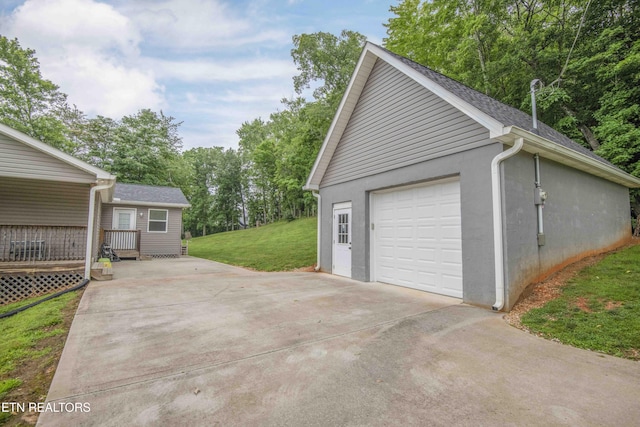 1359 Byrd Cir, Kingston, TN 37763 - detached garage featuring concrete driveway and view of wooded area
