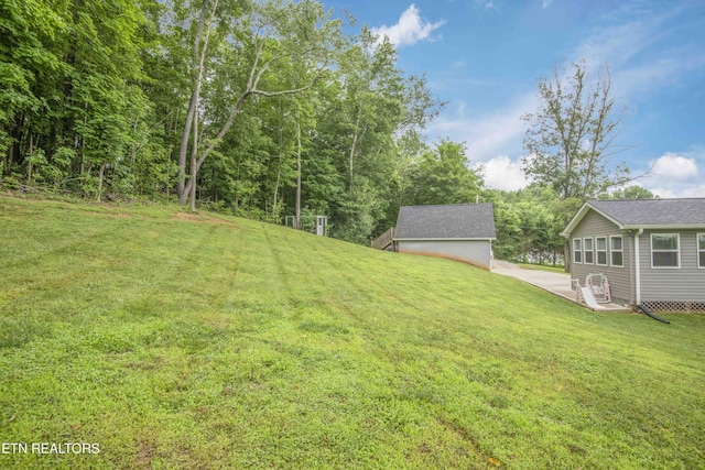 1359 Byrd Cir, Kingston, TN 37763 - view of green lawn featuring an outbuilding and a patio