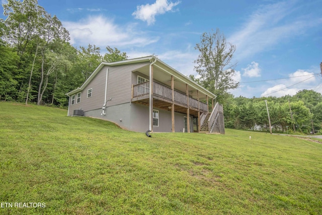1359 Byrd Cir, Kingston, TN 37763 - back of house with a wooden deck, stairway, a yard, and a wooded view