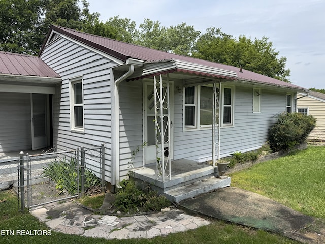 2101 NW Chillicothe St, Knoxville, TN 37921 - ranch-style house with a metal roof and a gate
