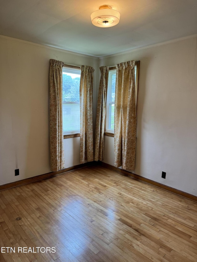 2101 NW Chillicothe St, Knoxville, TN 37921 - spare room with hardwood / wood-style flooring and crown molding