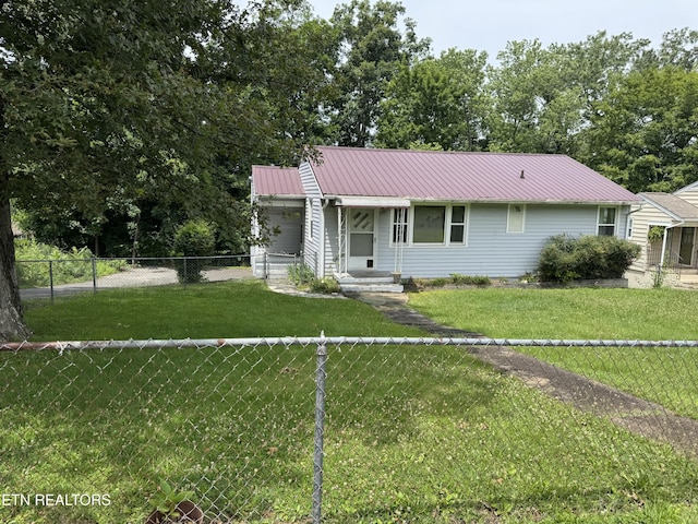 2101 NW Chillicothe St, Knoxville, TN 37921 - view of front facade featuring a metal roof and a fenced backyard