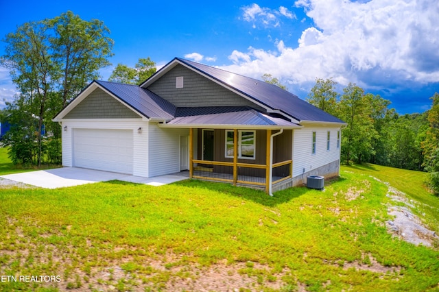 760 Rockview Rd, Jamestown, TN 38556 - view of front of property with covered porch, an attached garage, driveway, a front yard, and a metal roof