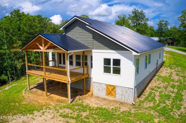 760 Rockview Rd, Jamestown, TN 38556 - back of property with a wooden deck, a metal roof, and french doors