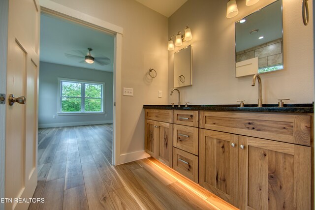 760 Rockview Rd, Jamestown, TN 38556 - full bathroom with double vanity, wood finished floors, and ceiling fan