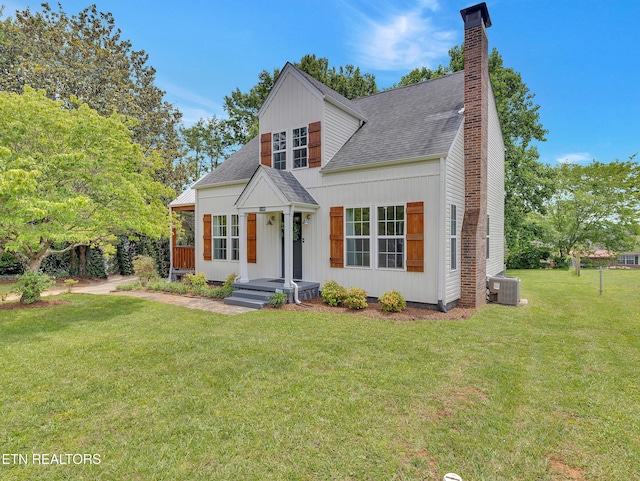 1100 Cedar Ln, Knoxville, TN 37912 - view of front of house featuring a shingled roof, a chimney, a front yard, and board and batten siding
