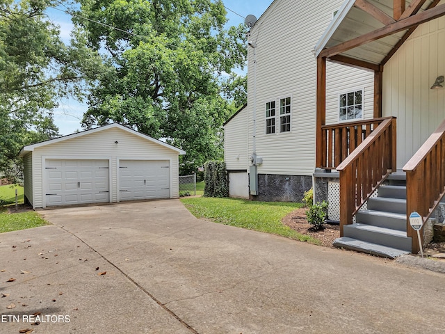 1100 Cedar Ln, Knoxville, TN 37912 - view of home's exterior with an outdoor structure and a garage