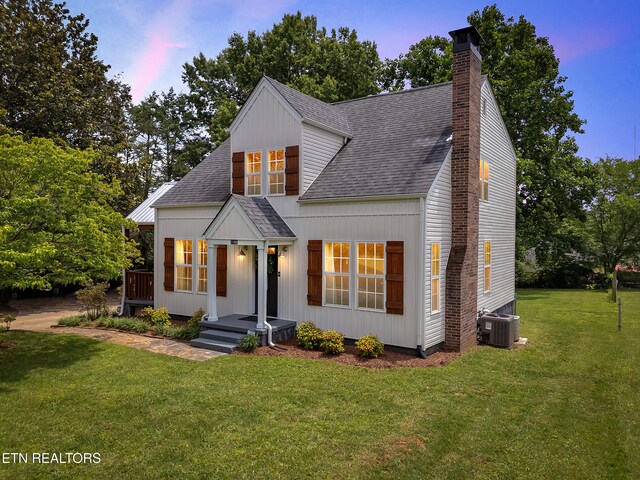 1100 Cedar Ln, Knoxville, TN 37912 - view of front of home featuring roof with shingles, a yard, and a chimney